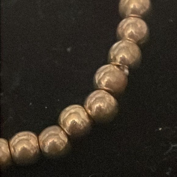 6” golden beaded stackable stretch bracelet with Eiffel Tower pendant & 39 beads - Picture 6 of 11